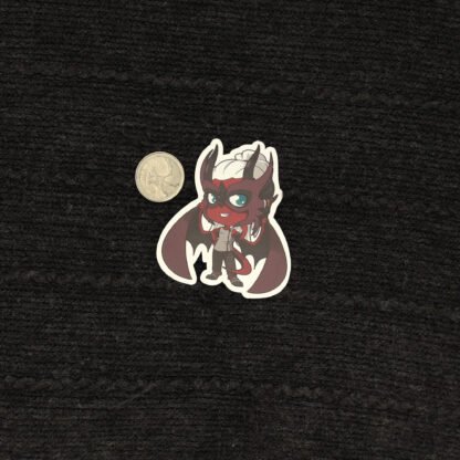 Daríus sticker with a quarter to show size.