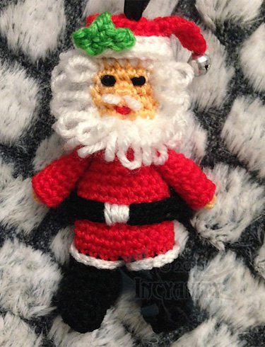 A crochet Santa Christmas ornament.